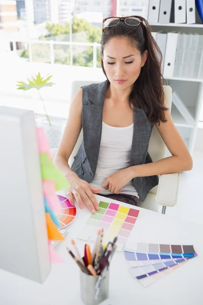 Concentrated female photo editor at work — Stock Photo, Image