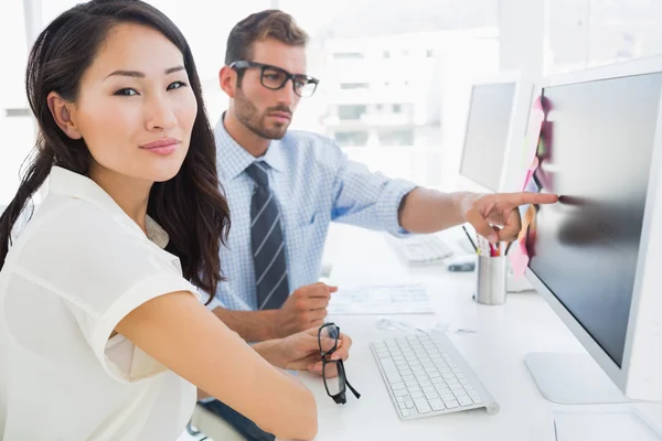 Side view of casual photo editors working on computer — Stock Photo, Image