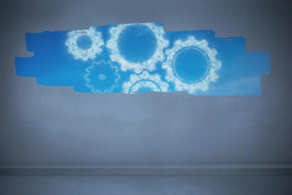 Дисплей на стене с облачными шестеренками и колесами — стоковое фото