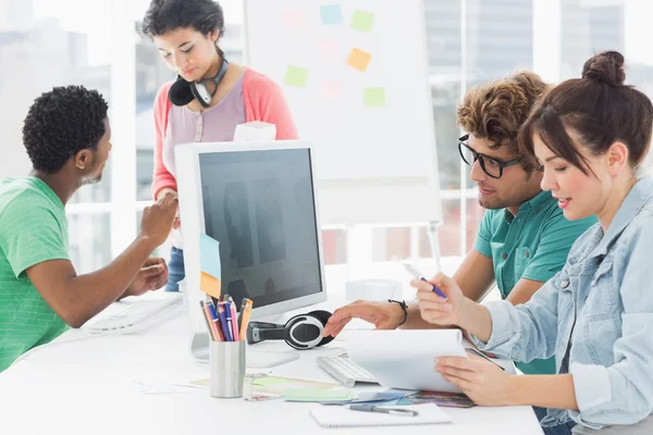 Artists working at desk in creative office — Stock Photo, Image