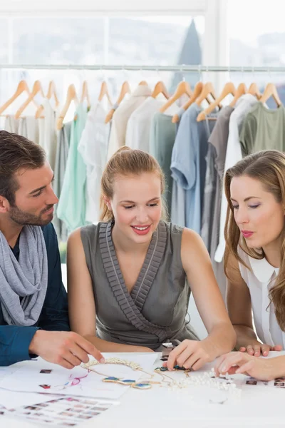 Three fashion designers discussing designs — Stock Photo, Image