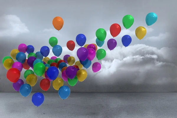 Many colourful balloons in cloudy room — Stock Photo, Image