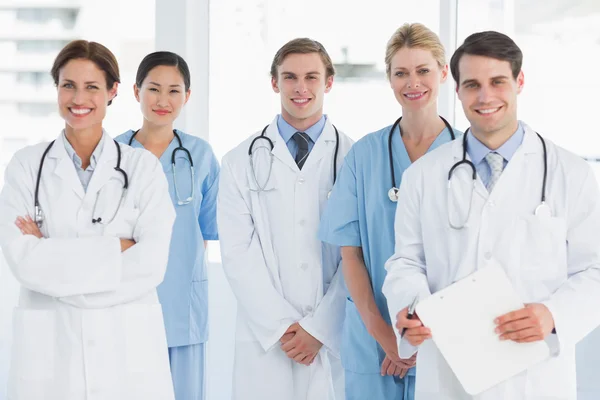 Doctors standing together at hospital Stock Image