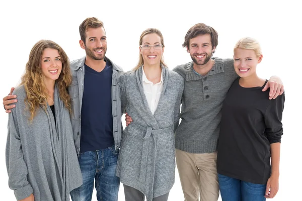 Group portrait of happy people standing with arms around — Stock Photo, Image