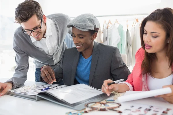 Fashion designers discussing designs — Stock Photo, Image