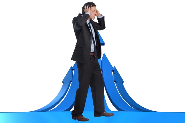 Composite image of stressed businessman with hands on head — Stock Photo, Image