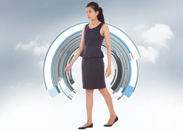 Composite image of asian businesswoman walking — Stock Photo, Image