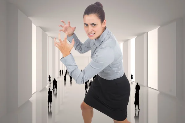 Composite image of furious businesswoman gesturing — Stock Photo, Image