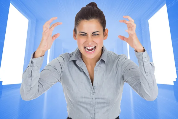 Composite image of furious businesswoman gesturing — Stock Photo, Image