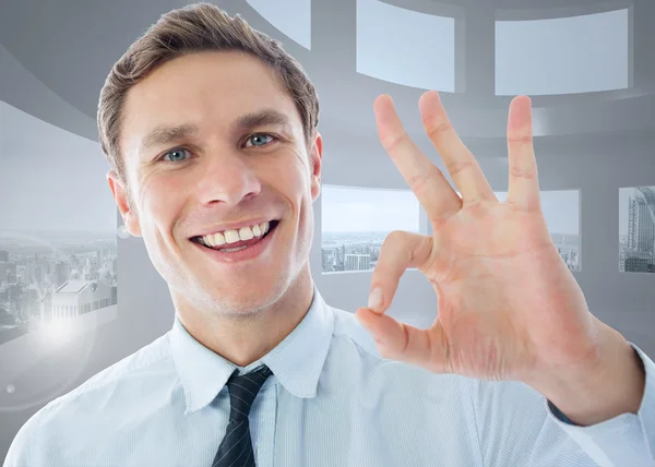 Imagen compuesta del hombre de negocios mostrando signo ok — Foto de Stock
