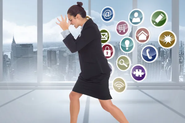 Composite image of angry businesswoman gesturing — Stock Photo, Image