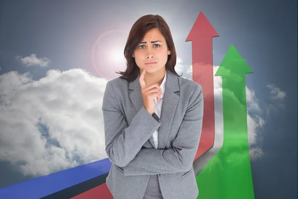 Composite image of worried businesswoman — Stock Photo, Image