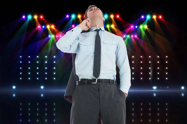 Composite image of serious businessman holding his jacket — Stock Photo, Image