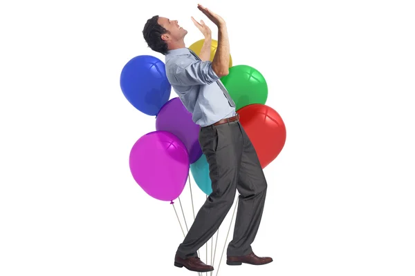 Composite image of businessman posing with arms raised — Stock Photo, Image