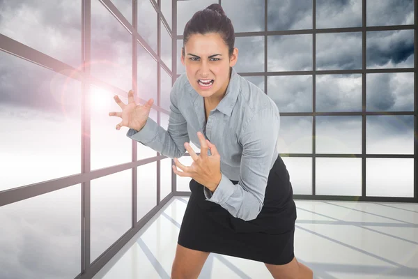 Sammansatt bild av rasande affärskvinna gesterande — Stockfoto