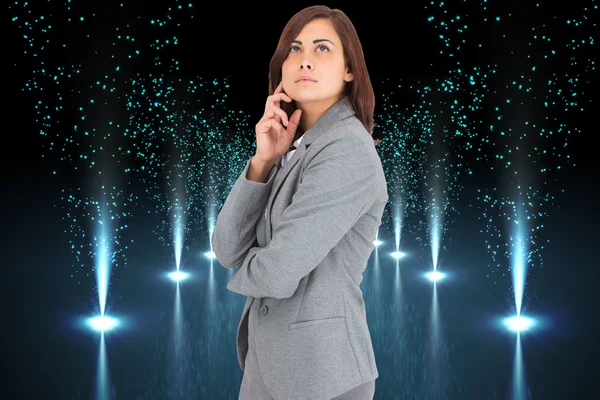 Composite image of concentrating businesswoman — Stock Photo, Image