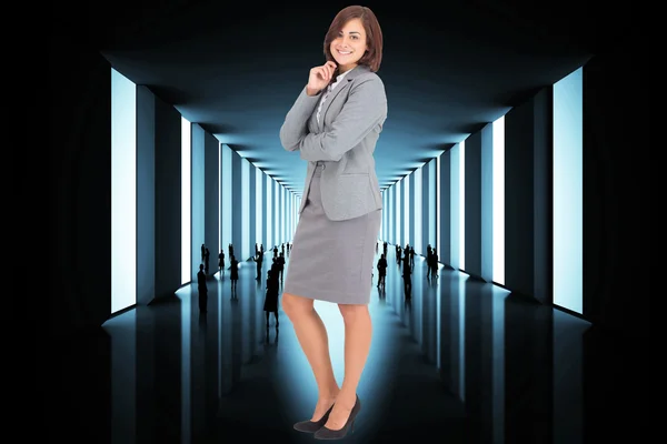 Composite image of smiling thoughtful businesswoman — Stock Photo, Image