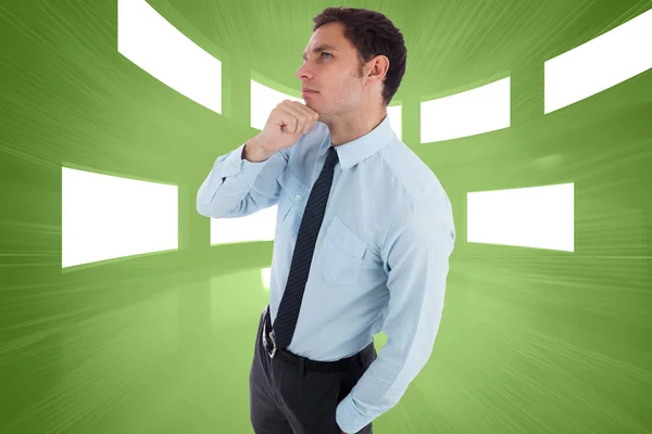 Composite image of thoughtful businessman with hand on chin — Stock Photo, Image