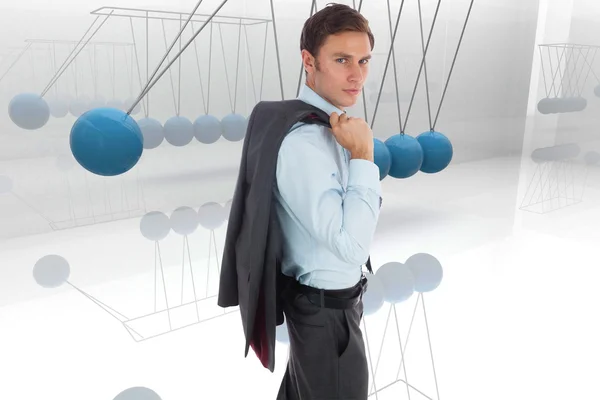 Composite image of serious businessman holding his jacket — Stock Photo, Image