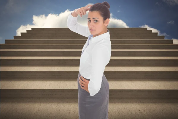 Composite image of worried businesswoman — Stock Photo, Image