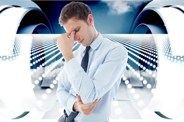 Composite image of businessman with a headache — Stock Photo, Image