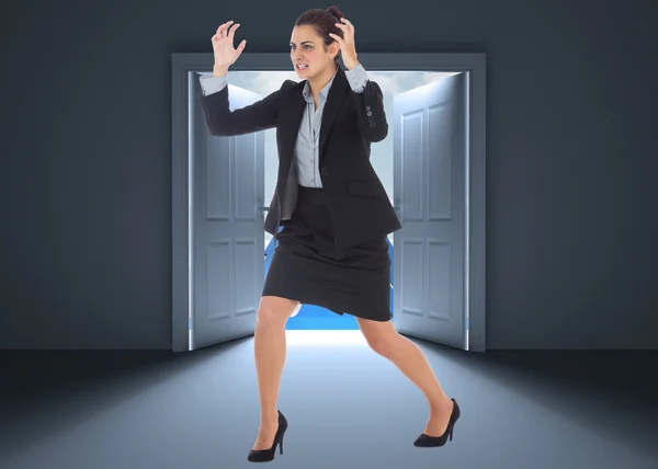 Composite image of angry businesswoman gesturing — Stock Photo, Image