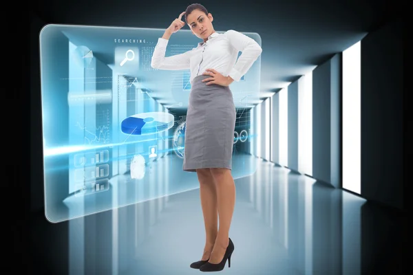 Composite image of focused businesswoman — Stock Photo, Image