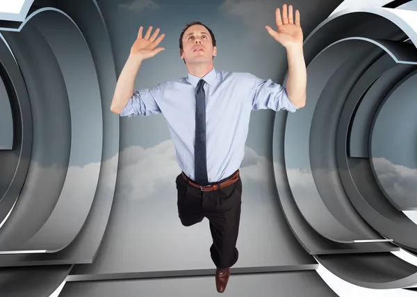 Composite image of businessman posing with arms raised — Stock Photo, Image