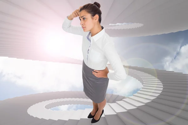 Composite image of worried businesswoman — Stock Photo, Image