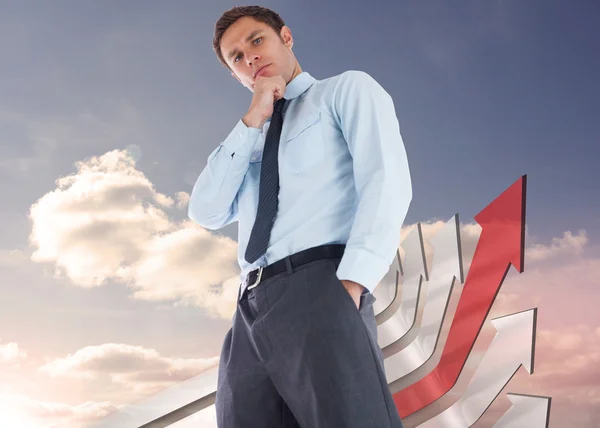 Composite image of thoughtful businessman with hand on chin — Stock Photo, Image