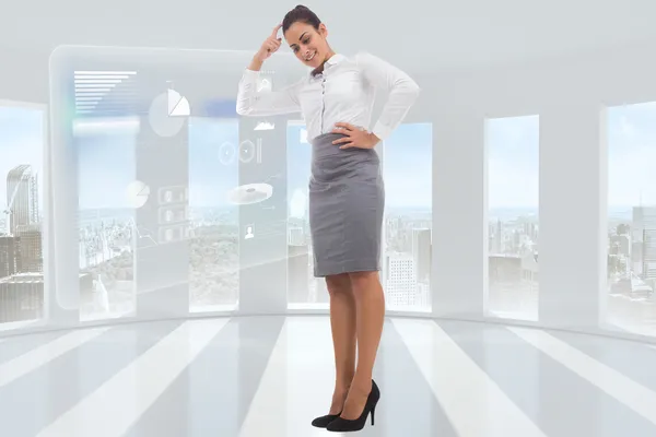 Composite image of smiling thoughtful businesswoman — Stock Photo, Image