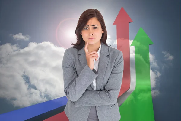 Composite image of worried businesswoman Stock Picture