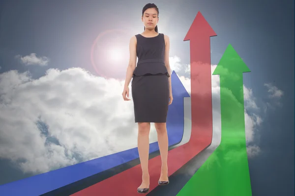 Composite image of asian businesswoman walking Stock Image