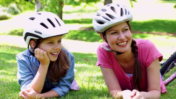 Mother and daughter having a rest on their bike ride — Stock Video