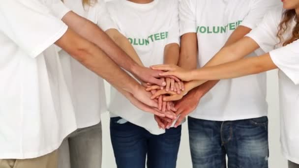 Volunteers putting hands together — Stock Video