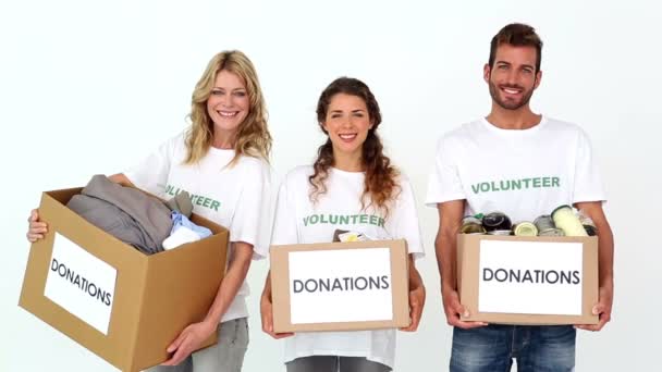 Team of volunteers holding donations boxes — Stock Video