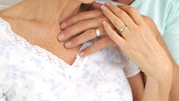 Married couple embracing in bed together — Stock Video