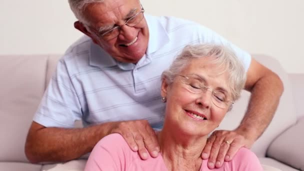 Senior man giving his wife a shoulder rub — Stock Video