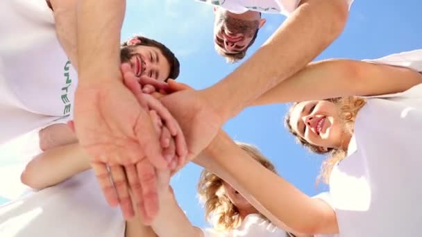 Volunteers putting hands together — Stock Video