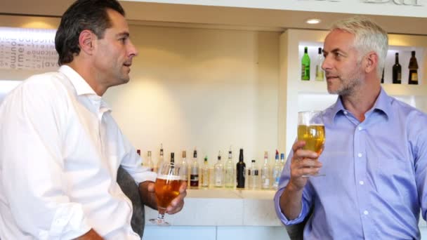 Male friends having a beer together — Stock Video