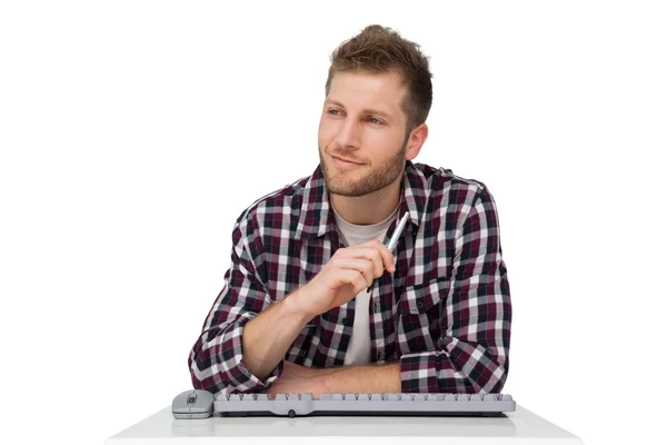 Thoughtful man with keyboard — Stock Photo, Image