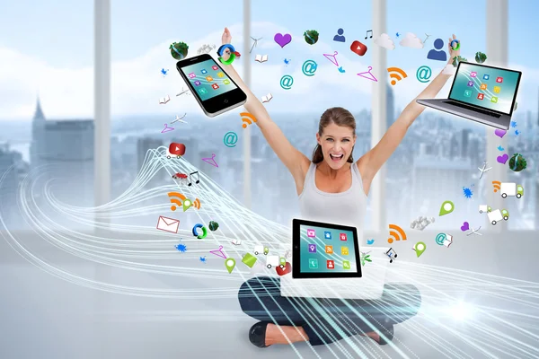 Cheering blonde using laptop with app icons — Stock Photo, Image