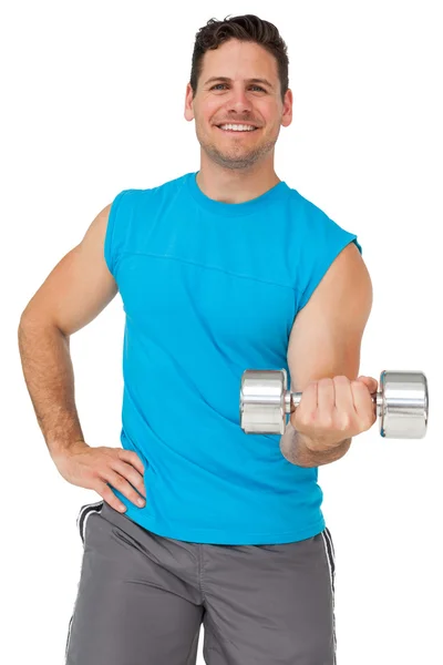 Portrait of a fit man exercising with dumbbell — Stock Photo, Image