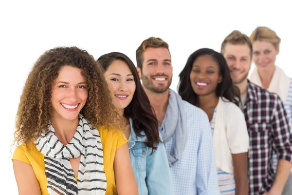 Happy group of young friends standing in a row — Stock Photo, Image