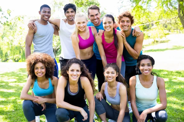 Friends in sportswear at park — Stock Photo, Image