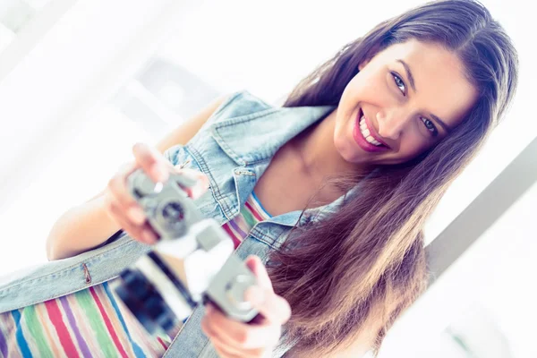 Brunette holding her camera — Stock Photo, Image