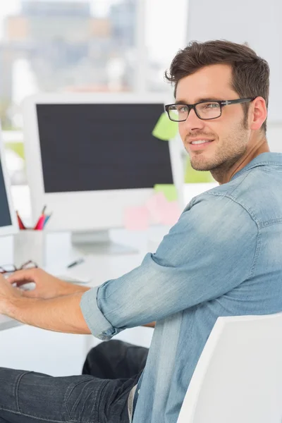 Side view portrait of a male artist using computer — Stock Photo, Image