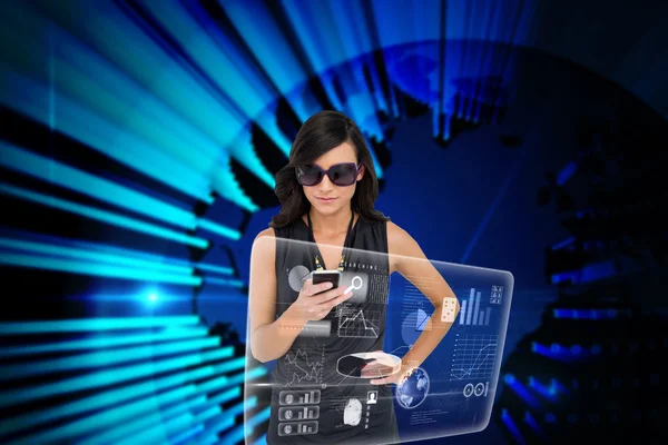 Glamorous brunette using smartphone — Stock Photo, Image