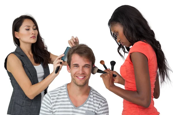 Assistants applying make-up model — Stock Photo, Image