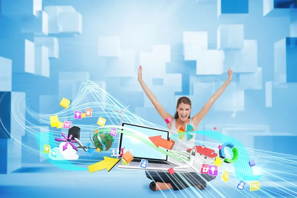 Cheering blonde using laptop with app icons — Stock Photo, Image